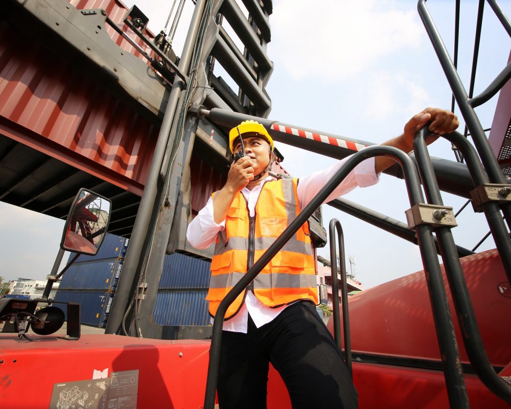 Foreman control Container Cargo freight ship at industry. Transportation and logistic concept. Foreman control Container Cargo freight ship at industry. Transportation and logistic concept.