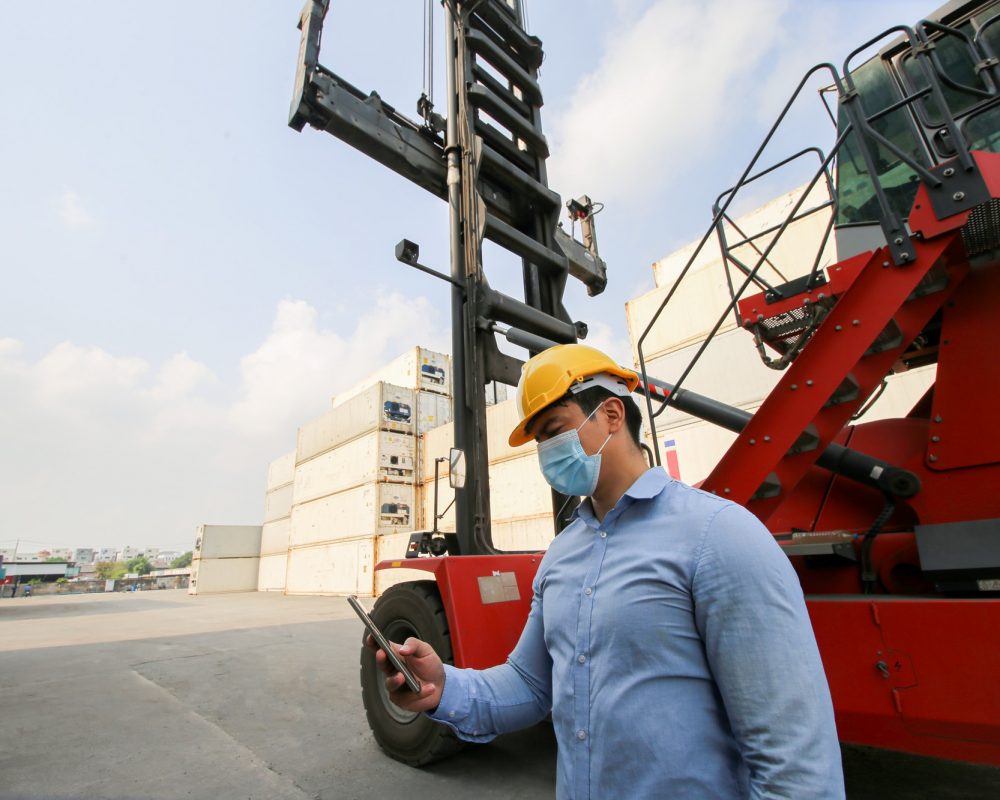 oreman control Industrial Container Cargo freight ship at industry. oreman control Industrial Container Cargo freight ship at industry.